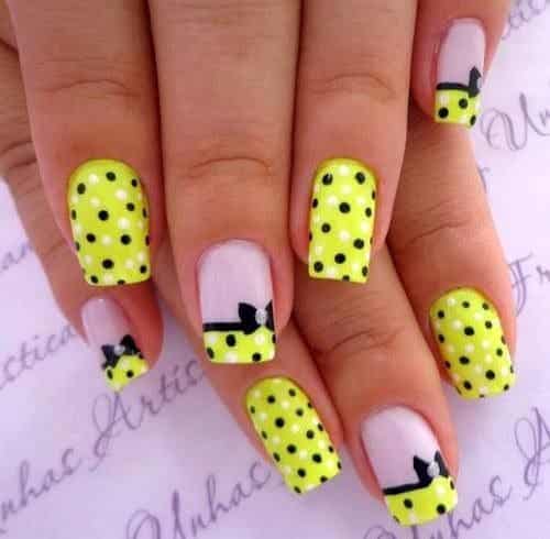 Adorable black and white polka dots on nails with bow