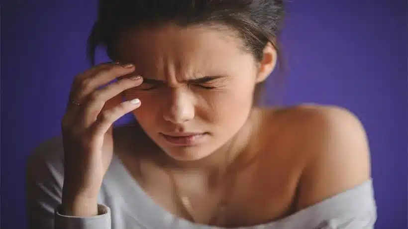 A girl suffering from headache after crying